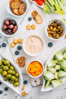 Crudites platter, raw vegetarian food or party vegetarian platter with various veggie snacks and dips