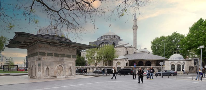 Istanbul, Turkey - May 5, 2023: Kilic Ali Pasha Fountain and Kilic Ali Pasha Mosque, built by Ottoman sultan Mahmud I, located in Tophane district of Beyoglu, beside Galataport cruise terminal