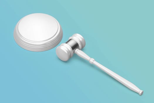 Shiny white gavel on blue background