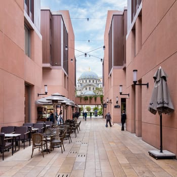 Istanbul, Turkey - May 5, 2023: Internal passage at Galataport mixed use development, with Nusretiye imperial Ottoman Mosque at the far end, located along shore of Bosphorus strait, Karakoy district