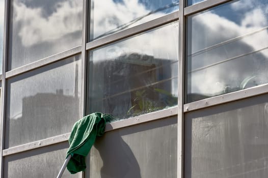 window washing, washing a street shop window. High quality photo