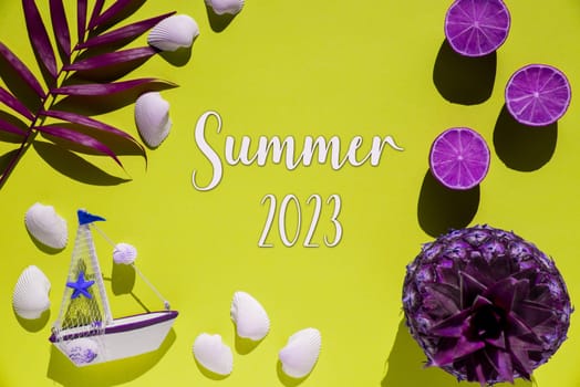 Flat Lay With English Text Summer 2023. Yellow Background Wit Decoration Like Purple Pineapple, Shells, Boat And Lemons.