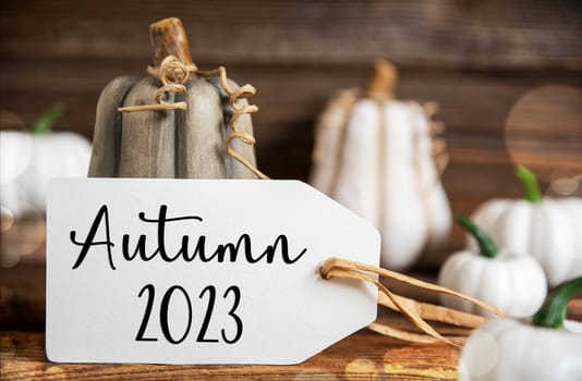 Autumn Decoration With Pumpkins, Rustic fall Decoration With Label Text Autumn 2023