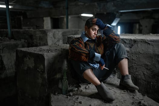 Depressed teenager woman beggar feeling disappointment sitting and smoking