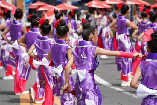 KAGAWA, JAPAN - JULY 15 2023: Japanese performers dancing in the famous Yosakoi Festival. Yosakoi is a unique style of Japanese dance event.