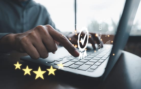Businessman use laptop computer showcasing ISO certification and quality assurance icon. Guarantee standards compliance and satisfaction. Modern technology device is the key