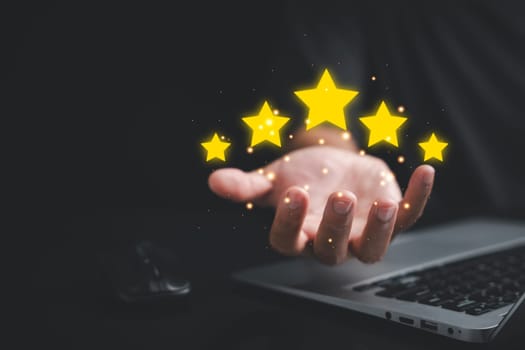 Give your business a boost with positive customer reviews Showcase your service rating with a hand holding five gold stars. Customer service and Satisfaction concept, 5 star rating