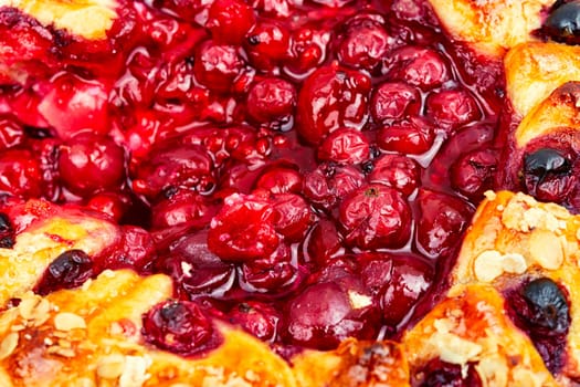 Summer pie with red currants and gooseberries. Close-up.