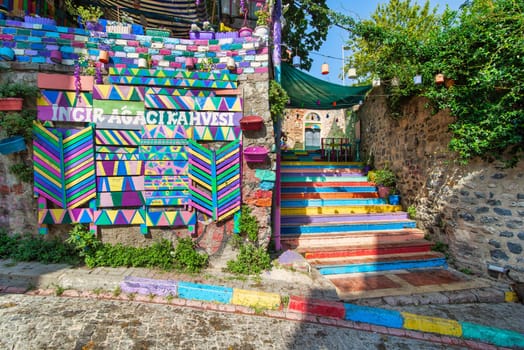 Exterior daytime shot of cafe decorated with multicolored panels and colorful stairs in Balat District, Istanbul, Turkey