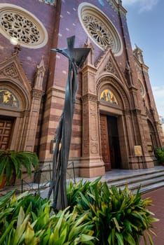 Modern art statue of Jesus Christ in front of St. Anthony of Padua Church, the largest Roman Catholic Church in Istanbul, located in Istiklal Street, Istanbul, Turkey