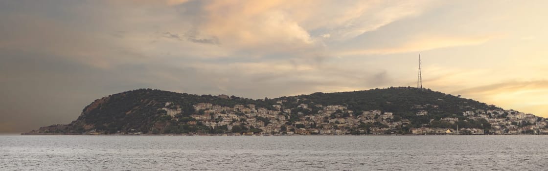 View of the mountains of Kinaliada island from Marmara Sea, with traditional summer houses and boats, Istanbul, Turkey