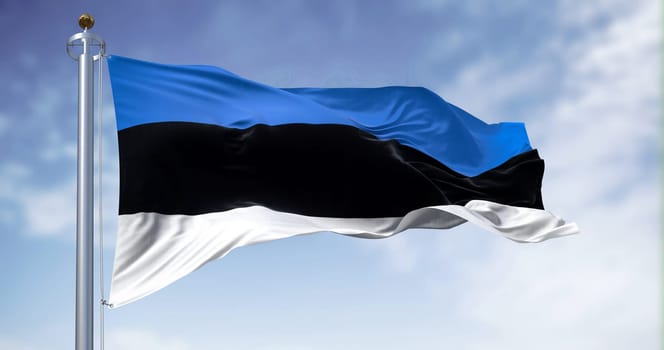 National flag of Estonia waving in the wind n a clear day. horizontal tricolor featuring three equal bands of blue, black and white. 3d illustration render. Fluttering fabric