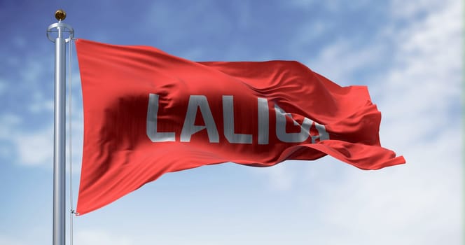 Madrid, SPA, July 10 2023: La Liga flag waving on a clear day. La Liga is the top professional football division of the Spanish football league system. Illustrative editorial 3d illustration render