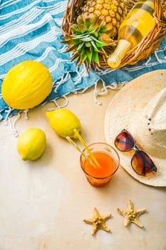 Summer holiday concept, summer accessories with refreshing juice and fresh fruits