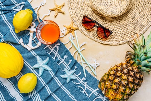 Summer holiday concept, summer accessories with refreshing juice and fresh fruits