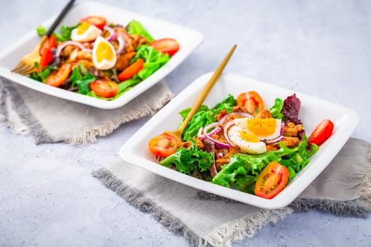 Summer mixed salad with roaster chanterelles mushrooms, tomato and egg