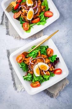 Summer mixed salad with roaster chanterelles mushrooms, tomato and egg