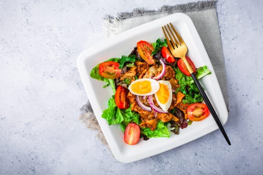 Summer mixed salad with roaster chanterelles mushrooms, tomato and egg