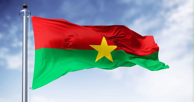 National flag of Burkina Faso waving in the wind on a clear day. Two equal horizontal red and green bands with a yellow five-pointed star in the center. 3d illustration render. Fluttering fabric