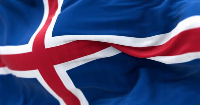 Close-up of Iceland national flag waving. Blue with a white cross and a red cross inside the white cross. 3d illustration render. Fluttering fabric background. Selective focus