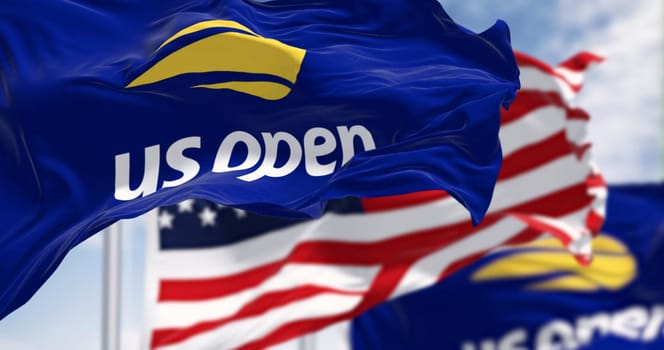 New York, US, July 2 2023: Us Open and the american flags waving on a clear day. Major tennis tournament held annually in New York. Grand Slam event. Illustrative editorial 3d illustration render