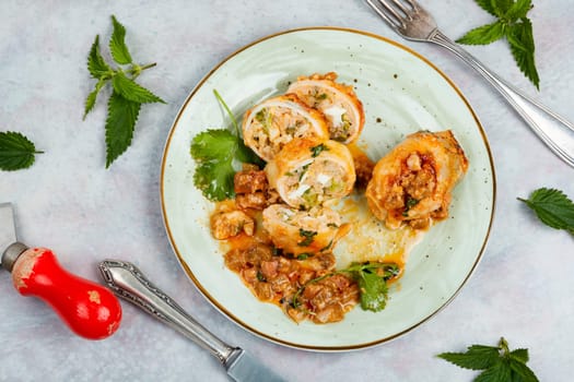 Sliced baked clams, squid stuffed with rice and nettle on a light grey background. Korea food.