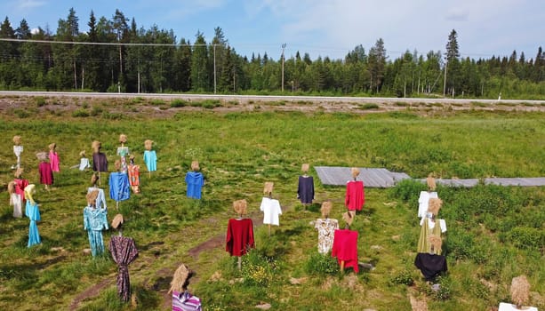 The silent people in Finland. Drone photo of the straw dolls in Lapland