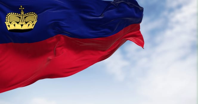 Liechtenstein national flag waving in the wind on a clear day. The Principality of Liechtenstein is a microstate located in the Alps. 3d illustration render. Fluttering fabric