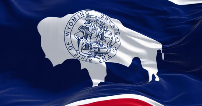 Close-up of Wyoming state flag waving in the wind. White Bison silhouette. 3d illustration render. Fluttering fabric background. US state flag