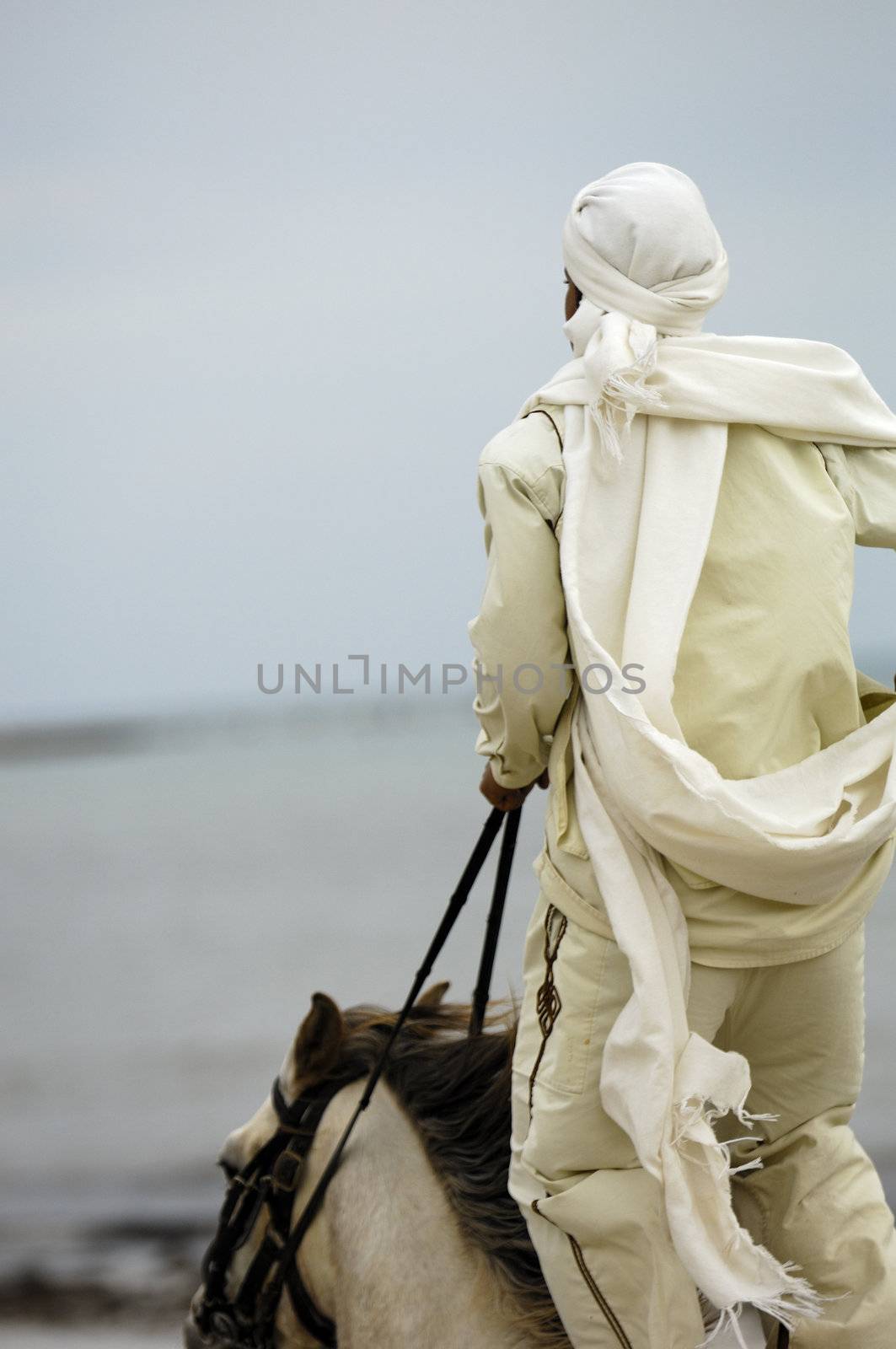 Man riding on the beach