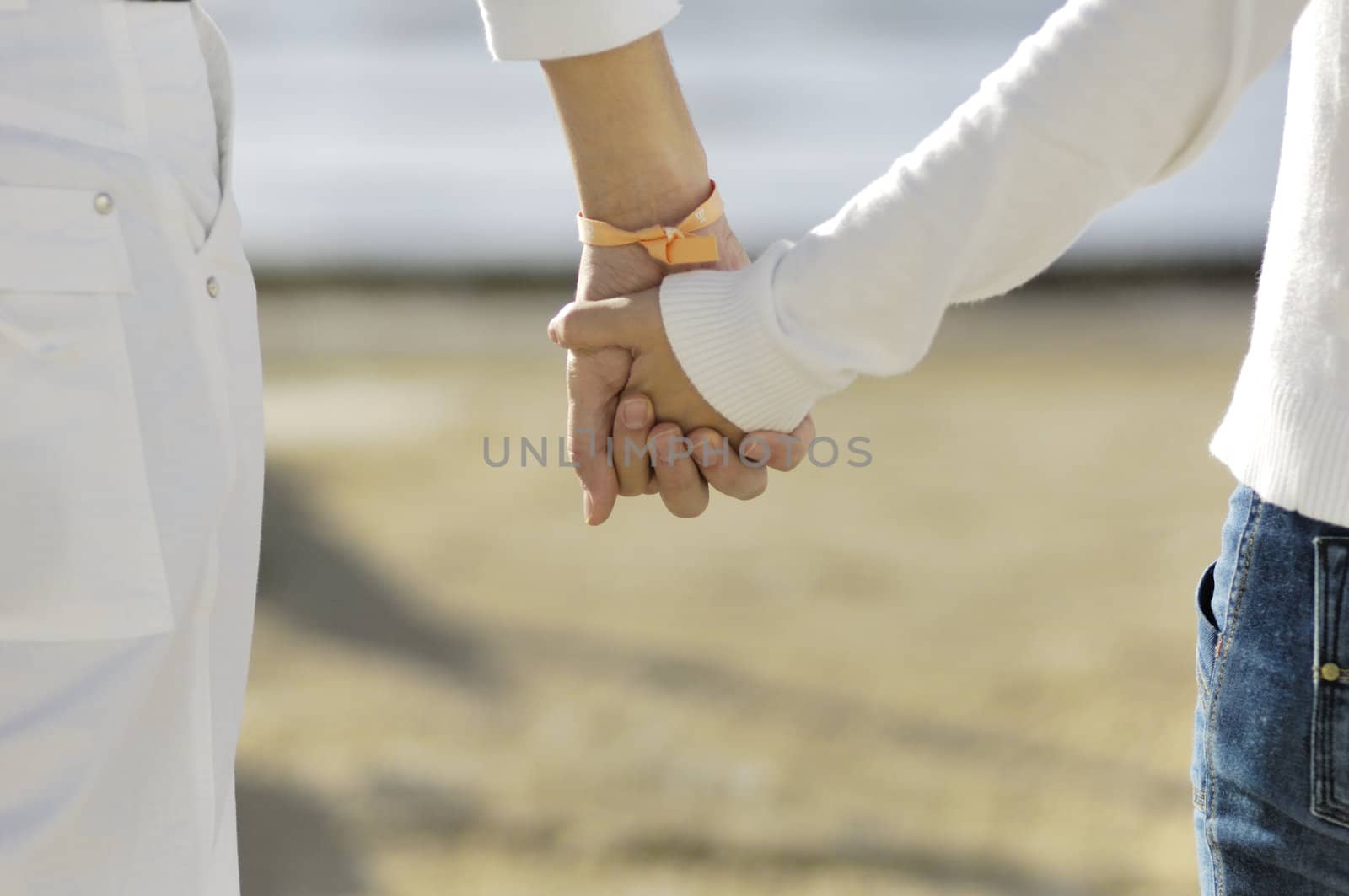 Couple holding each other hands