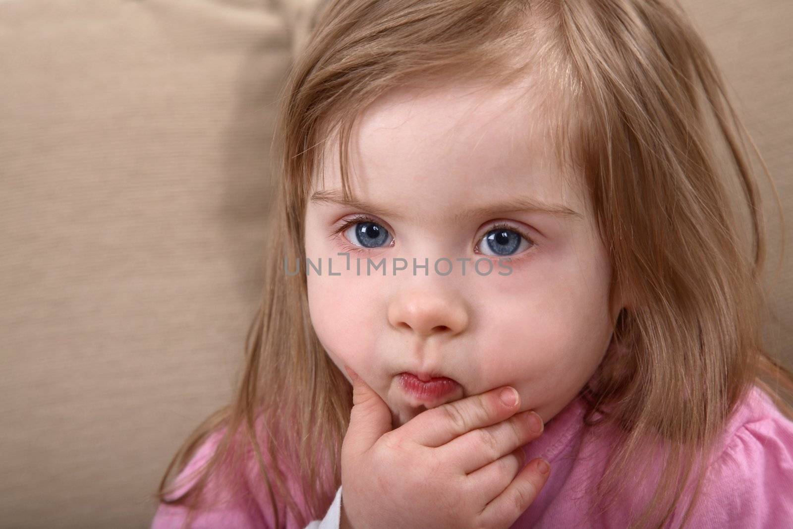 Portrait of little handicapped caucasian girl with Down Syndrome