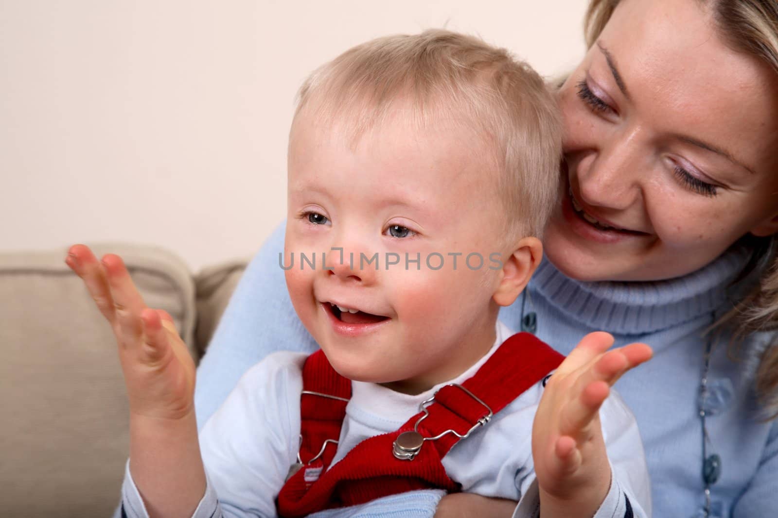 Down Syndrome boy with mother by linea