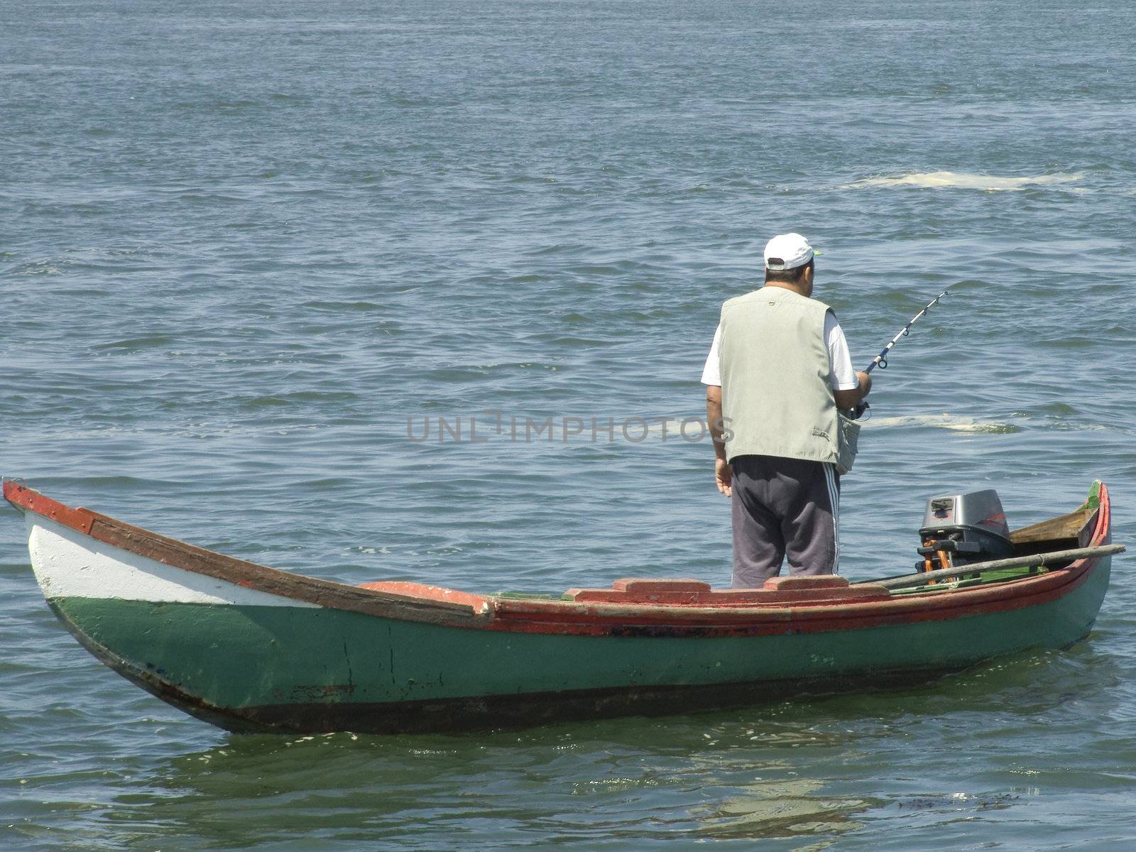 fisherman on old wood boat