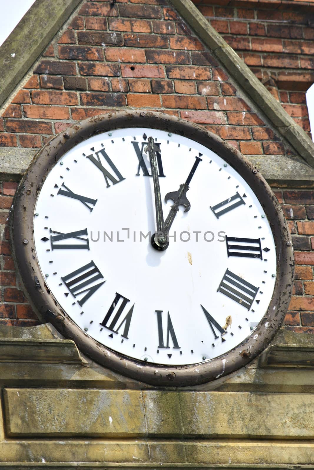 An old clock with a rusted frame