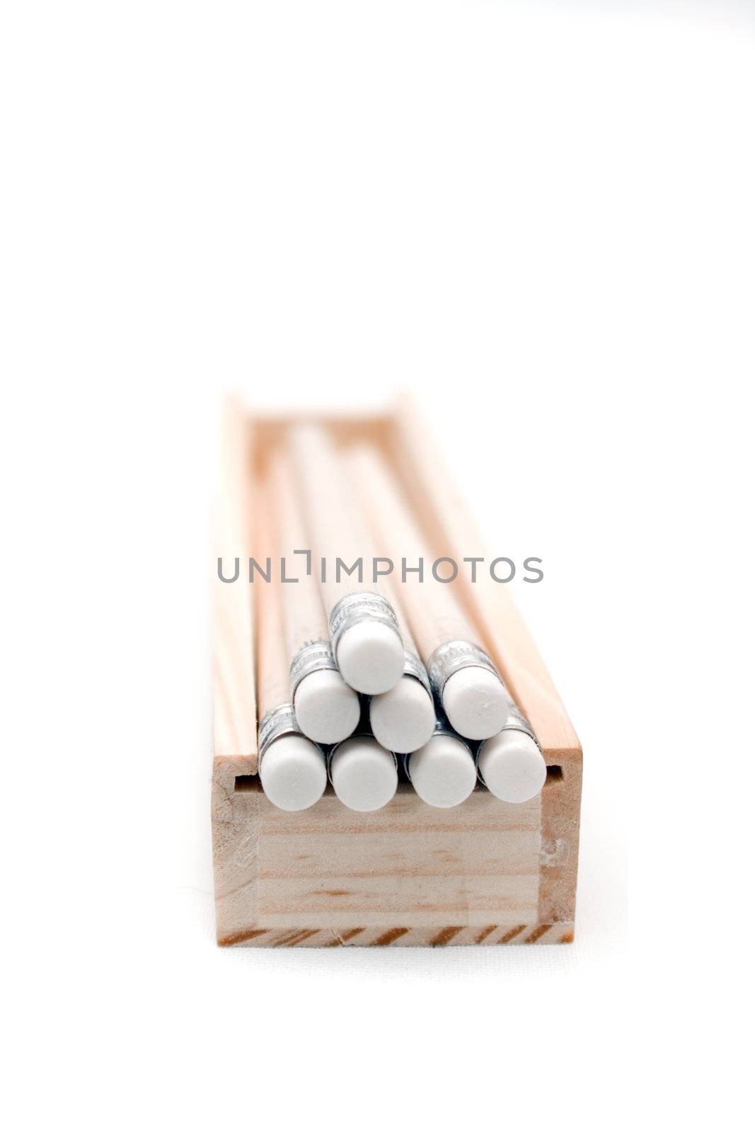 Box of wooden pencils with erasers, isolated on white background.
