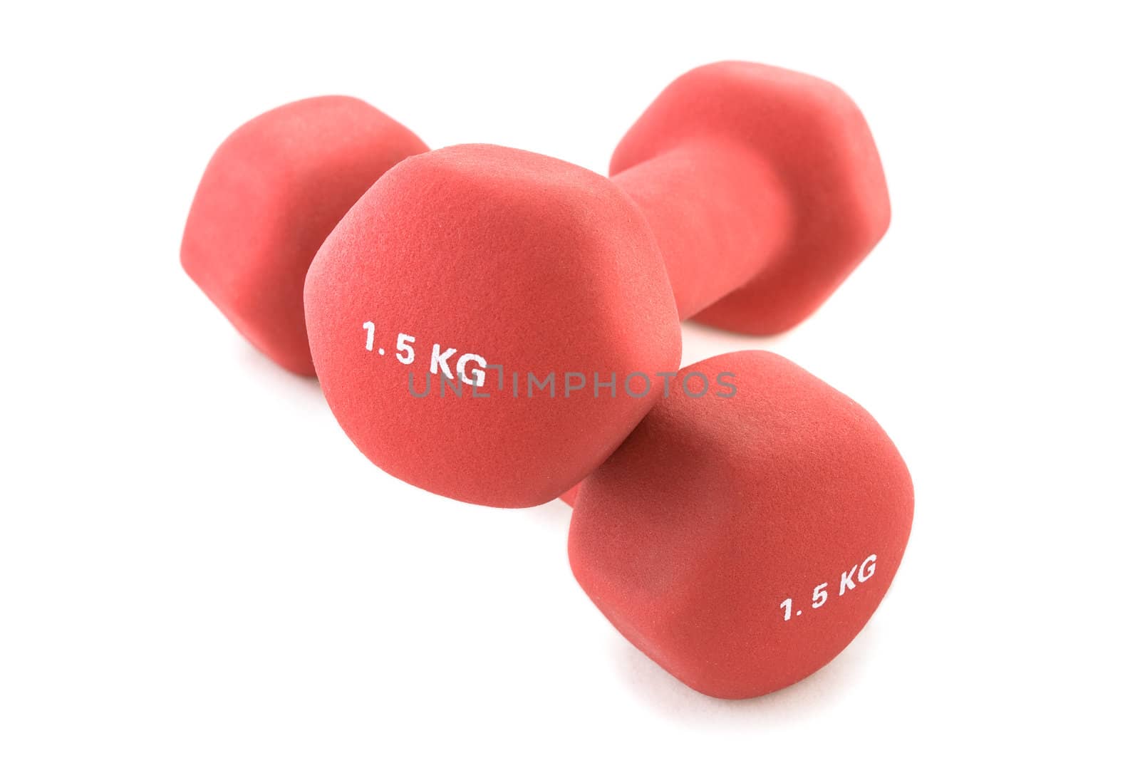 A pair of red dumbbells, isolated white