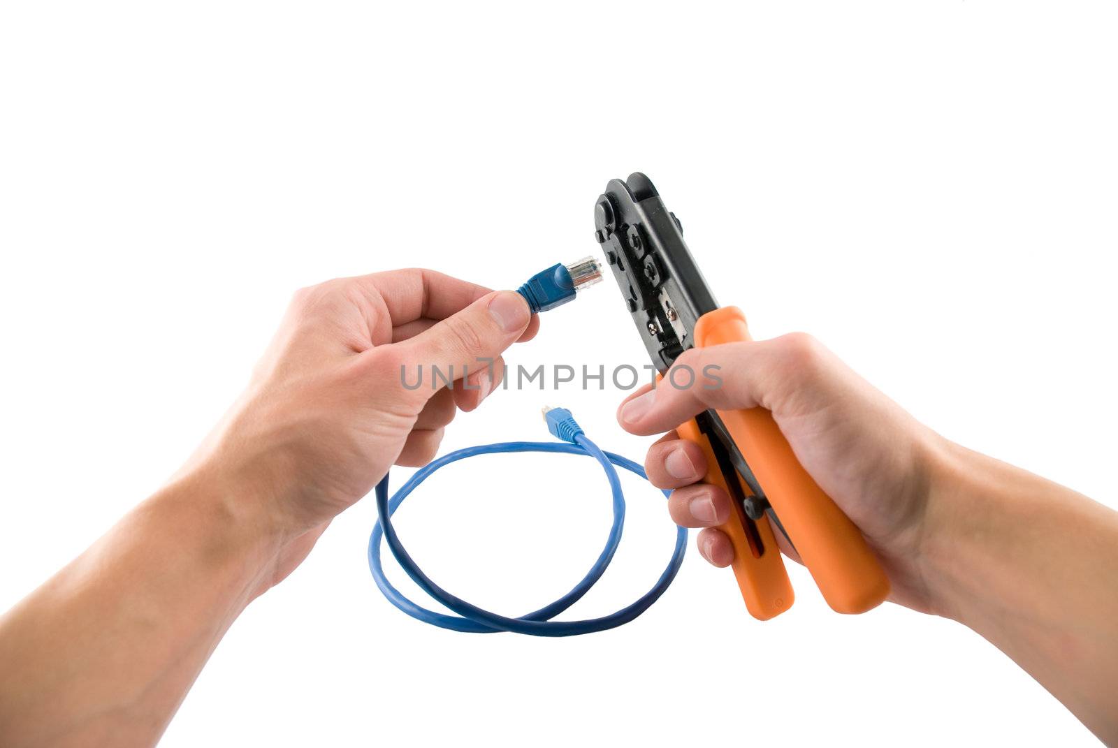 UTP patch tool in hands with wire, isolated white