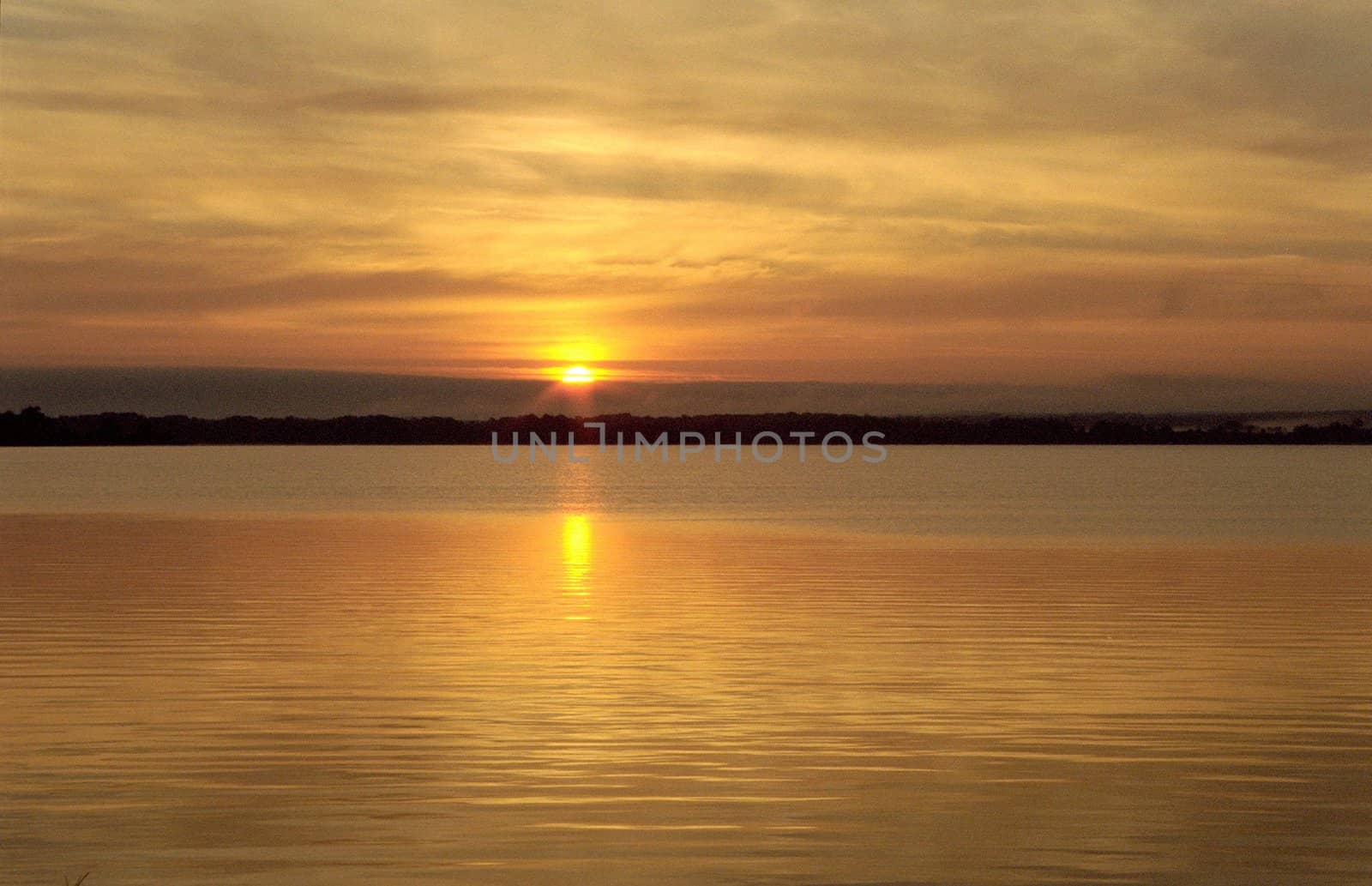 Sunset at a big calm lake