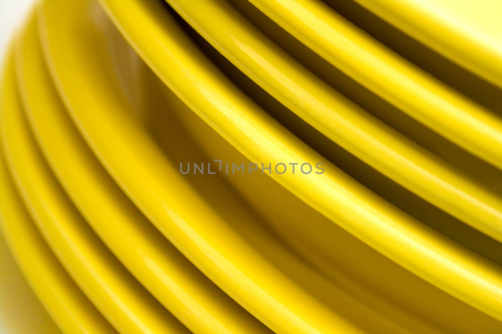 Stack of yellow plates isolated on white background.