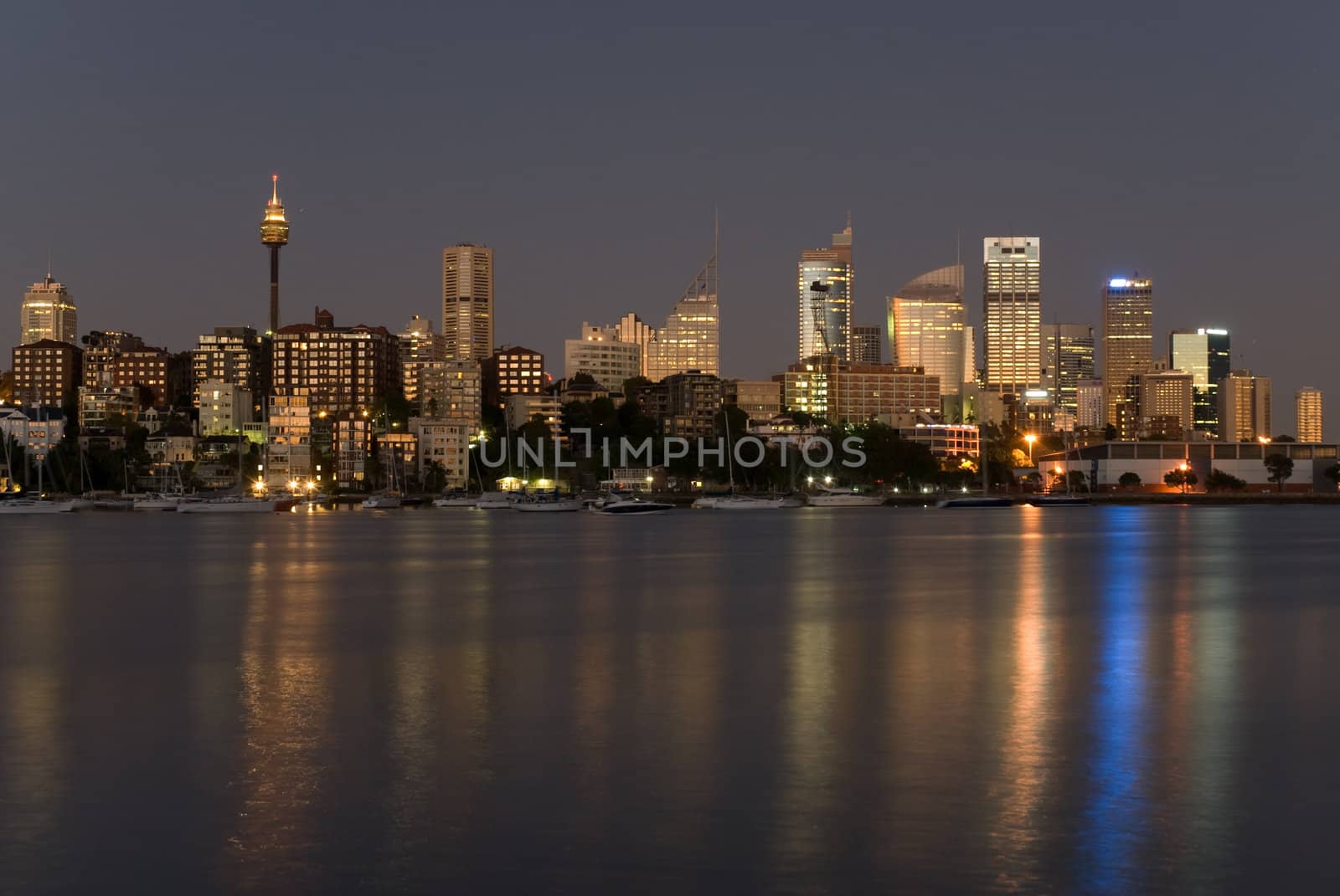 Australia, Sydney seafront with sky-scrapers, yachts at night