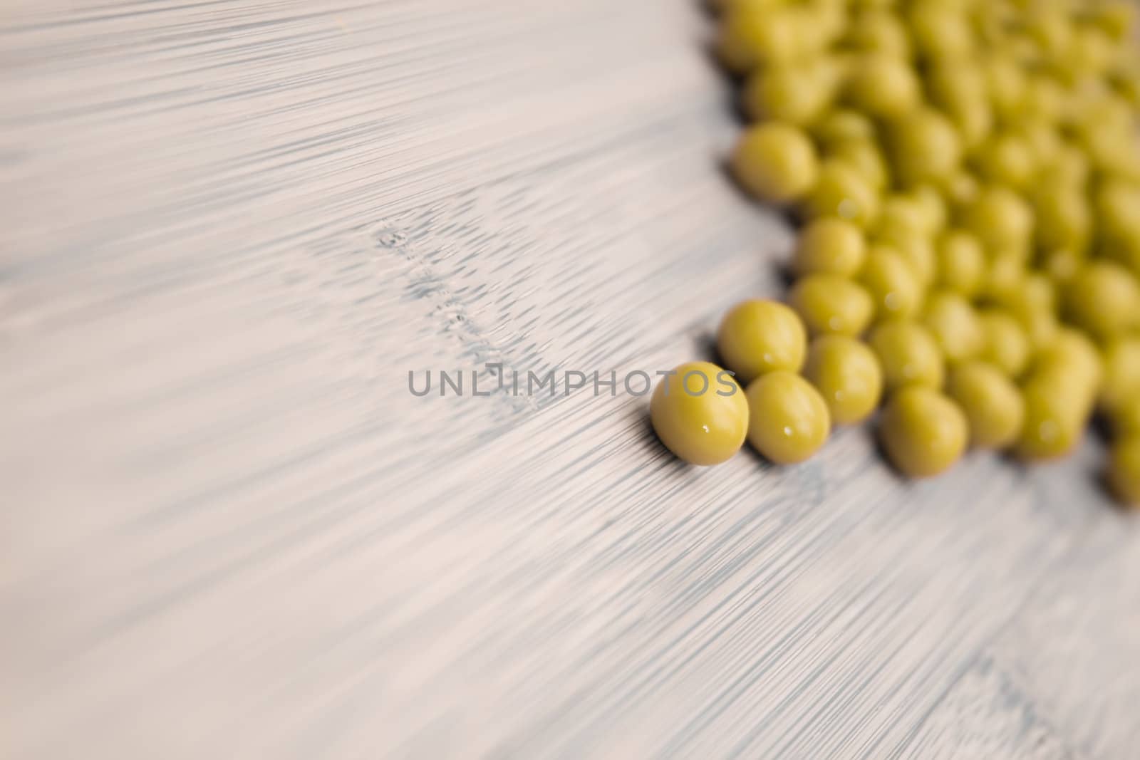 green peas on wooden background