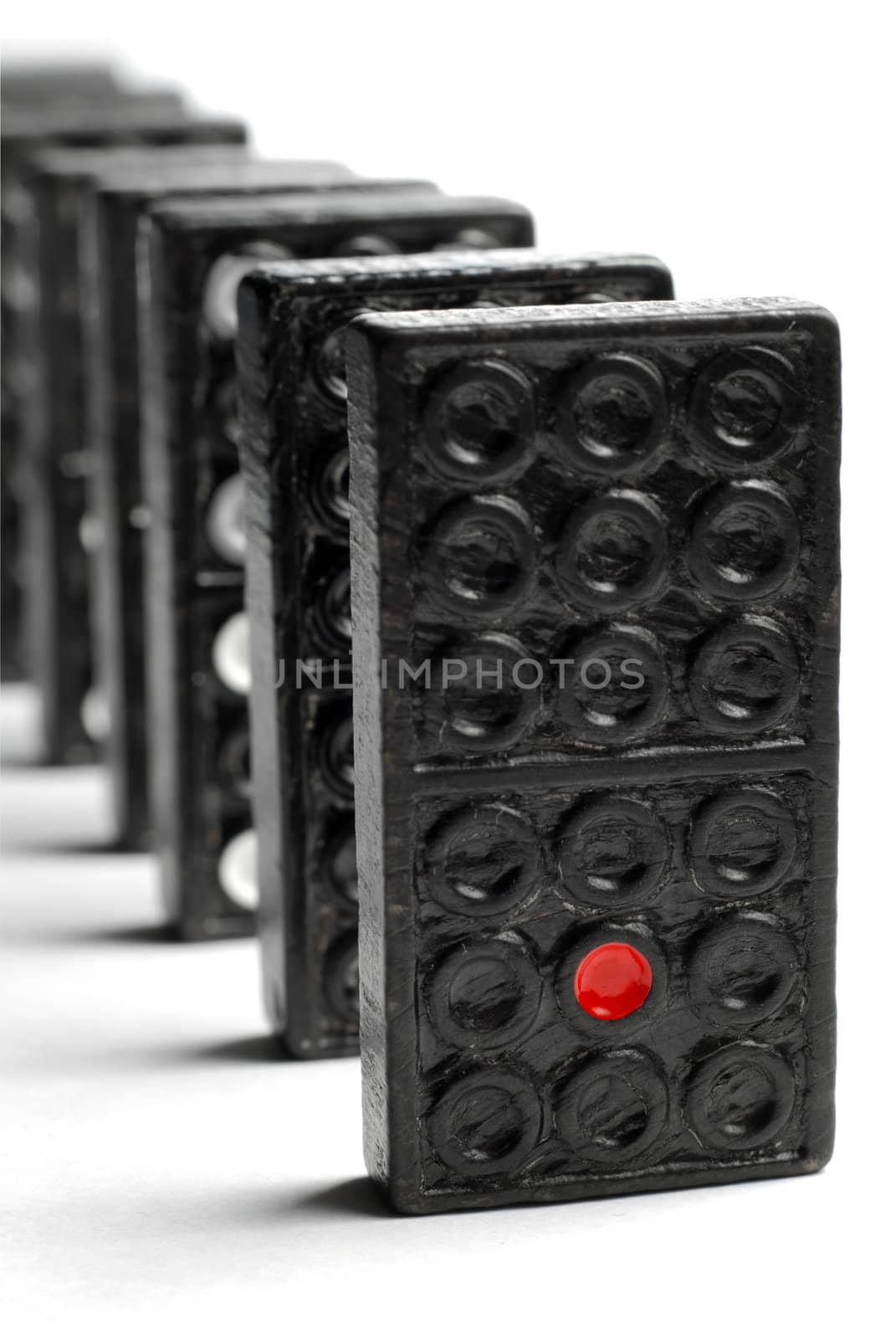 Line of domino blocks isolated on white background
