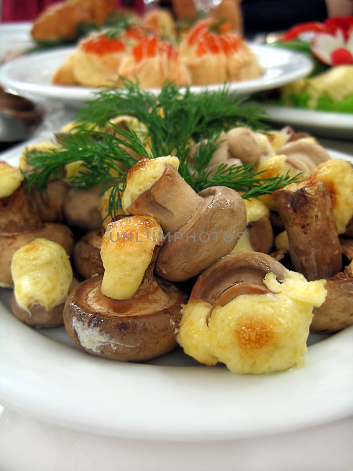 Baked mushrooms with cheese on plate