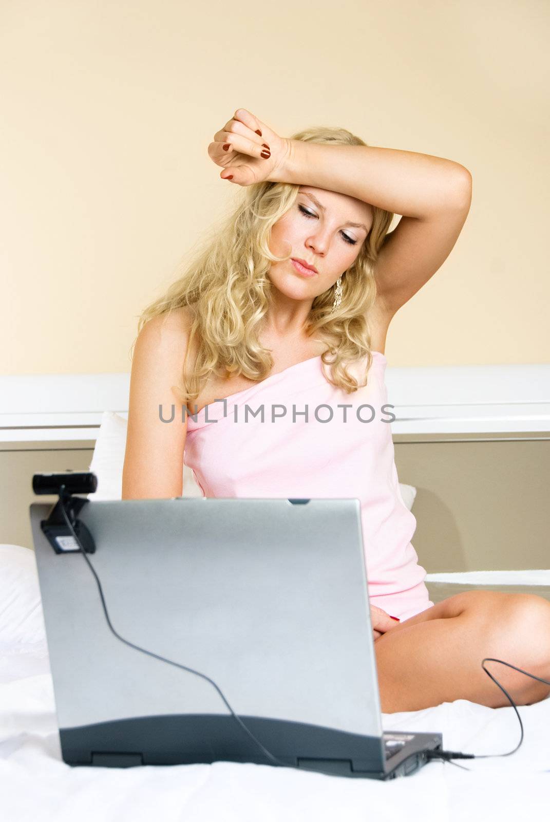 bored girl communicating using a web camera by lanak
