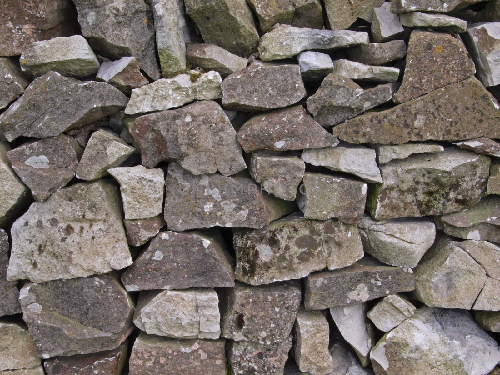Close-up of a dry stone, farm wall.