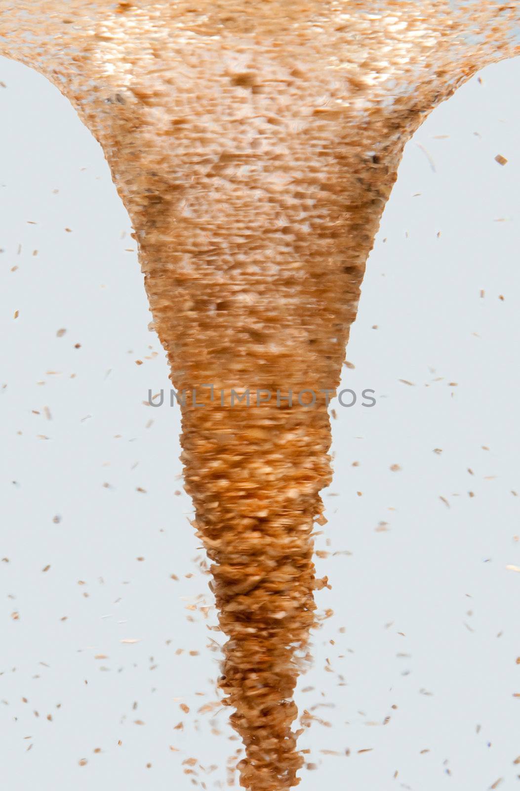 Side view of a tornado vortex swirl with wood chip debris, isolated