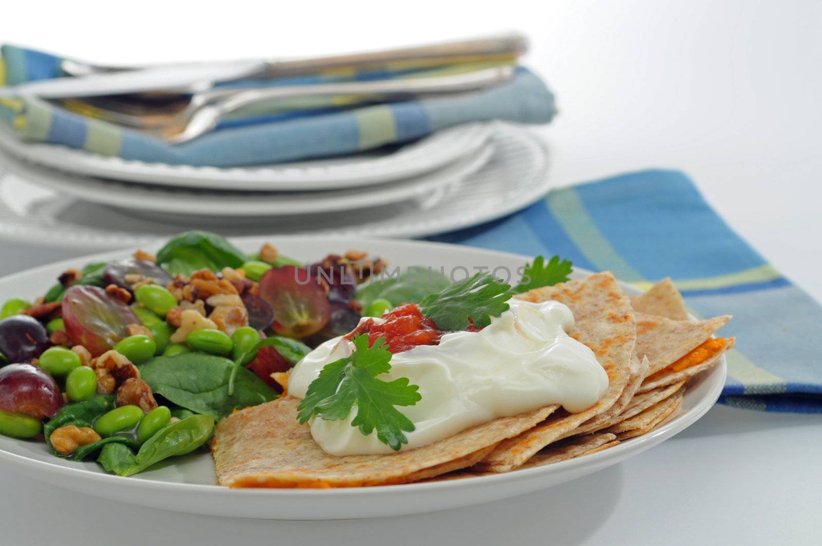 Delicious yam quesadillas served with a tasty salad.