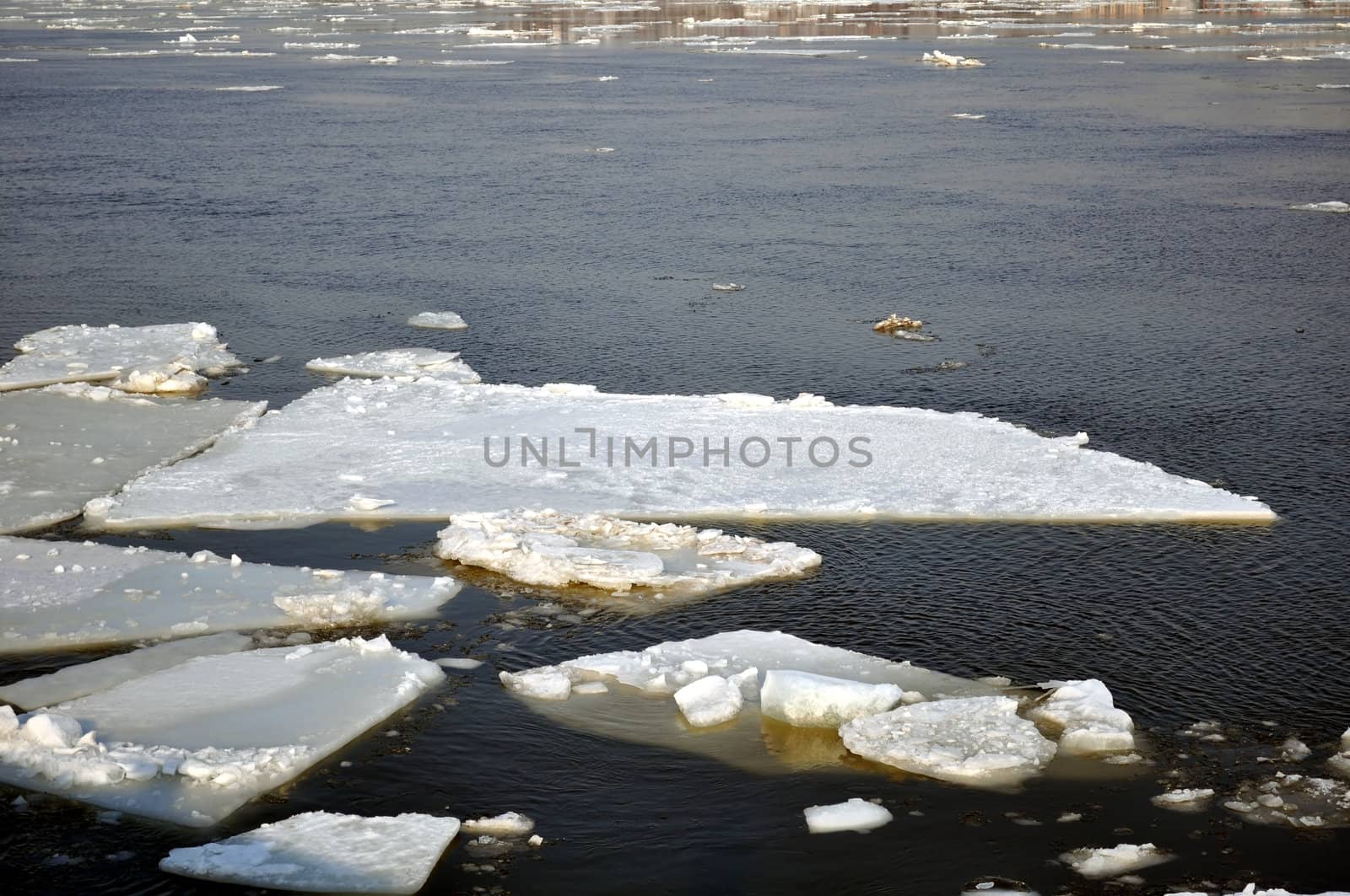 Winter scenery, ice blocks floating on river.