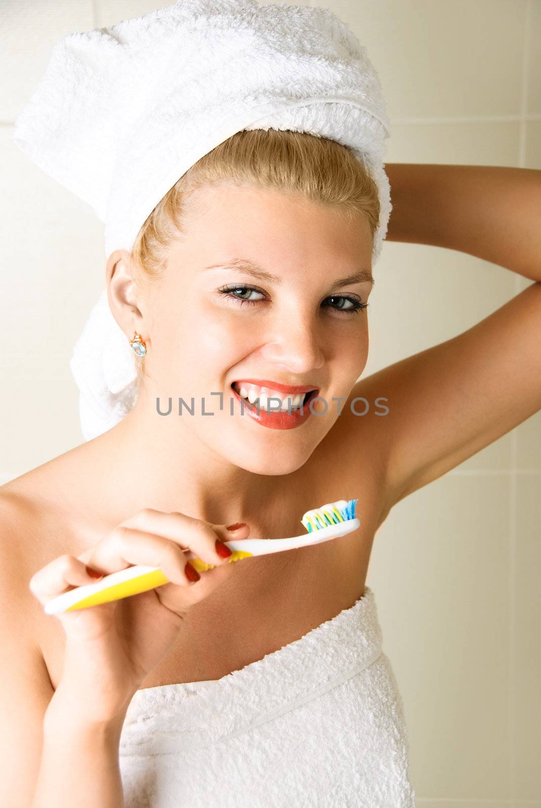 happy girl brushing her teeth by lanak